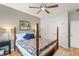 Well-lit bedroom with a four-poster bed, ceiling fan, and classic decor elements at 201 St Andrews Ave, Edinburgh, IN 46124