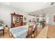 Dining area open to a modern kitchen features natural light, a wooden table, and a view of the kitchen at 201 St Andrews Ave, Edinburgh, IN 46124