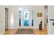 Bright entryway with hardwood floors and decorative glass front door at 201 St Andrews Ave, Edinburgh, IN 46124
