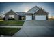 Stunning front exterior with a lush green lawn and a two-car garage at 201 St Andrews Ave, Edinburgh, IN 46124