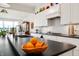 Bright kitchen showcasing a large island, stainless steel appliances, white cabinetry, and dark countertops at 201 St Andrews Ave, Edinburgh, IN 46124