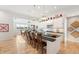 Spacious kitchen features a long island, ample seating, and an adjacent dining area with natural light at 201 St Andrews Ave, Edinburgh, IN 46124