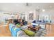 Open-concept living room with views of the kitchen, hardwood floors, and neutral decor; ideal for entertaining at 201 St Andrews Ave, Edinburgh, IN 46124