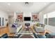 Cozy living room with a fireplace, comfortable sofas, and ample natural light at 201 St Andrews Ave, Edinburgh, IN 46124
