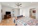 Bright and airy main bedroom boasting an entertainment center and outdoor views at 201 St Andrews Ave, Edinburgh, IN 46124