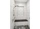 Accessible tiled shower features a built-in bench, showerhead, and convenient grab bars at 201 St Andrews Ave, Edinburgh, IN 46124