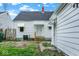 Exterior view of a backyard with a white house and a detached garage at 2015 S Hackley St, Muncie, IN 47302