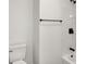 This bathroom showcases black fixtures, complemented by the toilet and shower area at 2015 S Hackley St, Muncie, IN 47302