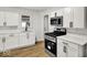 Beautiful kitchen with white cabinets and stainless steel range at 2015 S Hackley St, Muncie, IN 47302