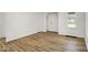 Bright living room with wood-look flooring and a fresh, neutral color palette at 2015 S Hackley St, Muncie, IN 47302