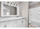 This renovated bathroom has a new vanity and shower at 2263 Rome Dr, Indianapolis, IN 46228