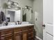 Well-lit bathroom featuring a double vanity and decorative mirrors, providing ample space at 2263 Rome Dr, Indianapolis, IN 46228
