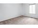 This carpeted bedroom features a window allowing for ample natural light at 2263 Rome Dr, Indianapolis, IN 46228