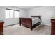 Comfortable bedroom with neutral carpet and a large window for ample lighting at 2263 Rome Dr, Indianapolis, IN 46228