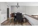 Dining room with modern decor including a dark wood table, a bench, and stylish lighting at 2263 Rome Dr, Indianapolis, IN 46228