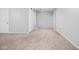 A white, neutral-toned living room features carpet and a ceiling fan at 2263 Rome Dr, Indianapolis, IN 46228