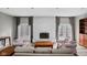 Bright living room with a white brick fireplace and lots of natural light at 2263 Rome Dr, Indianapolis, IN 46228