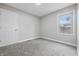 Cozy bedroom featuring neutral paint, soft carpet and ample natural light at 2315 Spann Ave, Indianapolis, IN 46203