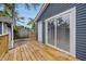 The freshly stained wooden deck offers a private outdoor space, perfect for relaxation and entertaining with sliding door entry at 2315 Spann Ave, Indianapolis, IN 46203