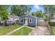 Charming home boasts new siding, front yard landscaping, and a cozy front porch, enhancing curb appeal at 2315 Spann Ave, Indianapolis, IN 46203