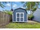 Backyard shed with white accents for storing tools and equipment while complementing the outdoor aesthetic at 2315 Spann Ave, Indianapolis, IN 46203