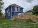 Home features a backyard with a wood deck, a balcony, and green grass at 24 N Randolph St, Indianapolis, IN 46201