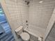 Updated bathroom with white subway tile and black and white mosaic floor at 24 N Randolph St, Indianapolis, IN 46201
