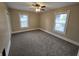 Bedroom featuring carpet, ceiling fan, and two windows that provide natural light at 24 N Randolph St, Indianapolis, IN 46201