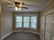 This carpeted bedroom has lots of natural light from the windows at 24 N Randolph St, Indianapolis, IN 46201