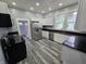 Bright kitchen features stainless steel appliances and black countertops at 24 N Randolph St, Indianapolis, IN 46201