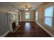 Spacious living room featuring a fireplace, hardwood floors, and natural light from several windows at 24 N Randolph St, Indianapolis, IN 46201