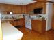 Kitchen with oak cabinetry, white countertops, and tile flooring at 2625 S 200 E, Lebanon, IN 46052