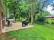 Backyard patio featuring grill, rocking chairs, and seating for outdoor entertaining at 2741 Fairlawn Dr, Columbus, IN 47203