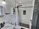 Modern bathroom featuring tiled shower with glass enclosure and contemporary fixtures at 2741 Fairlawn Dr, Columbus, IN 47203