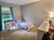 Bedroom with neutral walls, bright window, and writing desk at 2741 Fairlawn Dr, Columbus, IN 47203