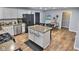 Spacious kitchen featuring an island, stainless steel appliances, and white cabinets at 2741 Fairlawn Dr, Columbus, IN 47203