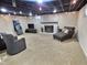 Finished basement living area featuring string lighting, fireplace, and comfortable seating at 2741 Fairlawn Dr, Columbus, IN 47203