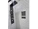 Close up of renovated shower stall with modern black fixtures and rain-style shower head at 2741 Fairlawn Dr, Columbus, IN 47203