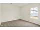 Cozy bedroom with neutral carpet and a view of the backyard through the window at 2750 Glade Ave, Plainfield, IN 46168
