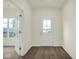Bright entryway features attractive laminate flooring and a glass panel door at 2750 Glade Ave, Plainfield, IN 46168