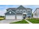 Charming two-story home featuring a three-car garage and eye-catching blue siding at 2750 Glade Ave, Plainfield, IN 46168