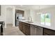Spacious kitchen with stainless steel appliances and island featuring a dishwasher at 2750 Glade Ave, Plainfield, IN 46168