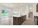 Open concept kitchen, island, dining area, and staircase at 2750 Glade Ave, Plainfield, IN 46168