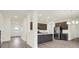 Stylish open kitchen with a center island, stainless appliances, and dark cabinets at 2750 Glade Ave, Plainfield, IN 46168