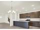 Modern kitchen featuring a center island, stainless appliances, and dark cabinetry at 2750 Glade Ave, Plainfield, IN 46168