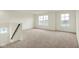 The living room has plush carpeting and is brightly lit with large windows, offering a comfortable living space at 2750 Glade Ave, Plainfield, IN 46168