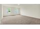 Large living room with large windows providing natural light and beige carpet, offering comfort and style at 2750 Glade Ave, Plainfield, IN 46168