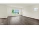 Expansive living room featuring beautiful laminate flooring and large window at 2750 Glade Ave, Plainfield, IN 46168