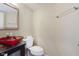 Stylish half bathroom with a unique vessel sink and modern fixtures at 2916 Sunmeadow Way, Indianapolis, IN 46228