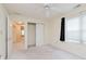 Bright bedroom with closet, ceiling fan, and large window, offering comfortable living space at 2916 Sunmeadow Way, Indianapolis, IN 46228